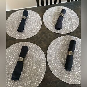Set a four placemats with napkin rings and black napkins. 12 piece set.